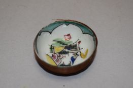 A small Chinese porcelain bowl with stylised scene to the interior, the exterior bound with fine