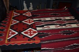 Two vintage North Navaho American Native style wall hangings with a geometric design. 79cm x 80cm