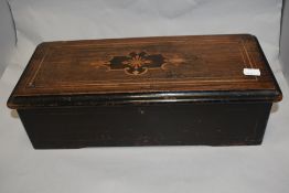 A late Victorian 'Swiss' six air cylinder music box, of hinged rectangular form with inlaid