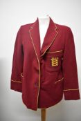 A 1950s red college or school blazer, with embroidered shield with BGS above three lions.