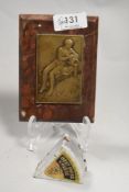 A 19th century marble paperweight, having brass to centre depicting maiden with water urn