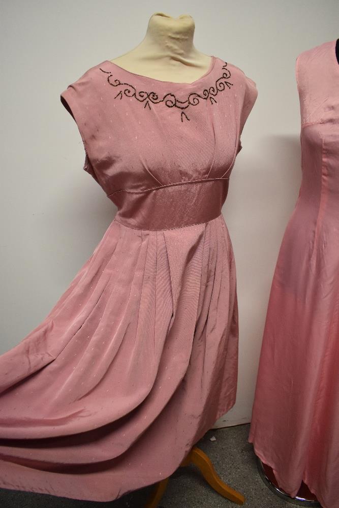 A 1950s grosgrain dress in rose pink, having full pleated skirt, beading to bust and half belt to - Image 4 of 8