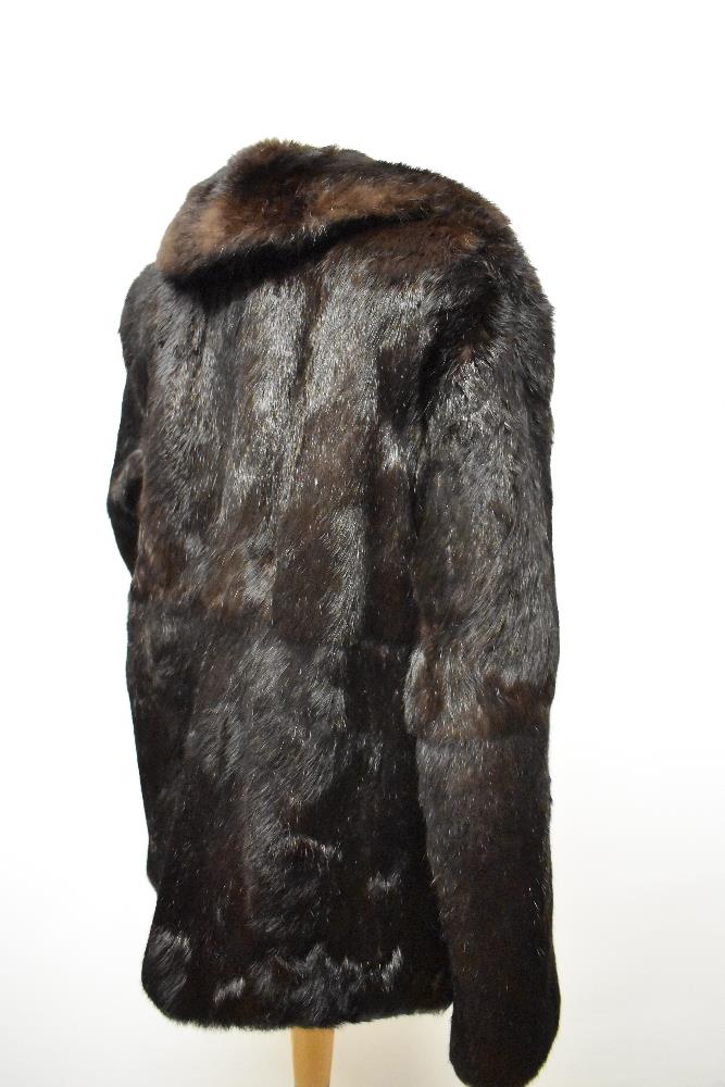 A vintage Coney fur coat, medium size.