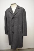 A gents single breasted 1960s coat, having Breakwater shower proof Burton label.