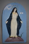 A glazed chalk ware plaque depicting the Virgin Mary with serpent underfoot.