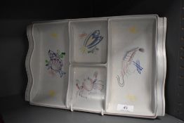 A Poole Pottery serving dish, having seafood designs to compartments.