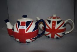 Two modern teapots decorated with Union Jack flags.