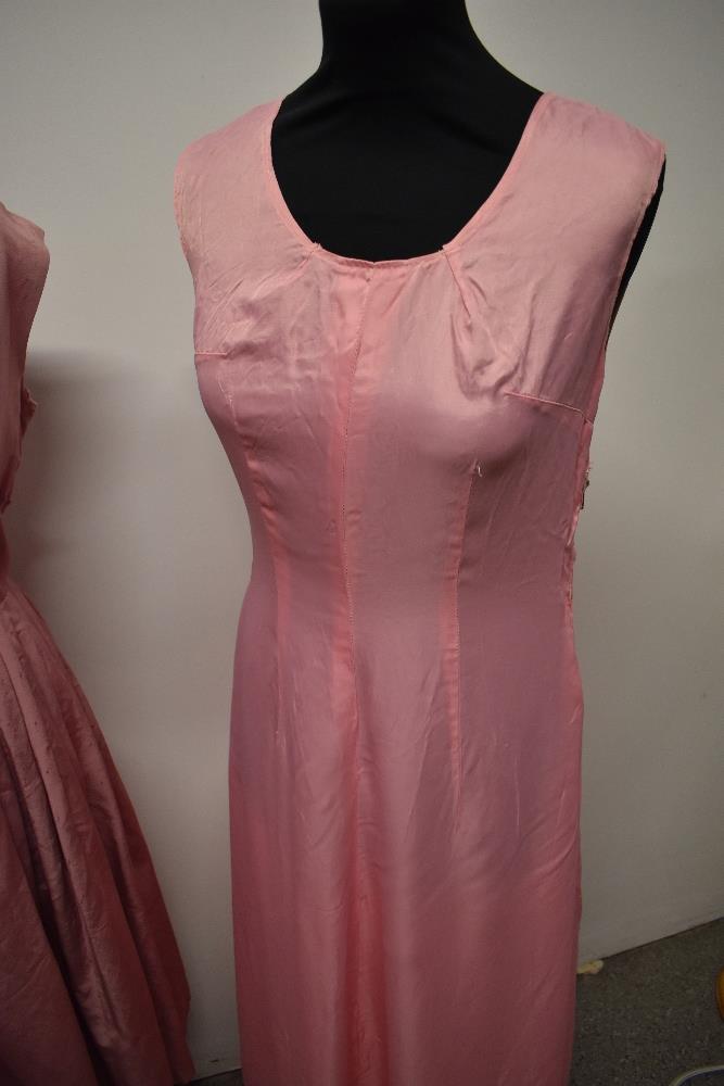 A 1950s grosgrain dress in rose pink, having full pleated skirt, beading to bust and half belt to - Image 2 of 8