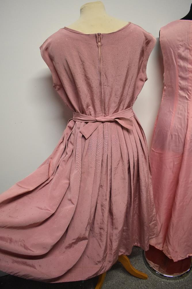 A 1950s grosgrain dress in rose pink, having full pleated skirt, beading to bust and half belt to - Image 7 of 8