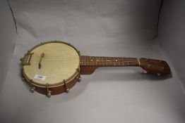 A Welton of Germany four string banjo, measuring 50cm long