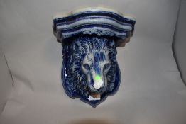 A Rhenish pottery salt glazed lion head wall bracket.