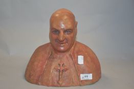 A well modelled terracotta/earthernware bust of a Catholic clergyman, with patinated finish.