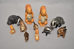 A group of Beswick pottery squirrels, comprising; 1007 standing, 1008 lying and 1008 with nut