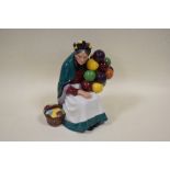 A Royal Doulton Porcelain figurine 'The Old Balloon Seller' HN1315, modelled by Leslie Harradine,