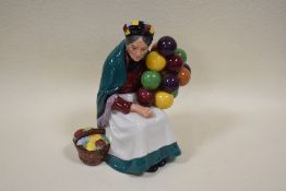 A Royal Doulton Porcelain figurine 'The Old Balloon Seller' HN1315, modelled by Leslie Harradine,