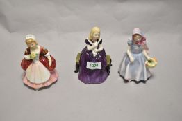 A group of three Royal Doulton porcelain figurines, comprising Affection HN2236, Wendy HN2109 and