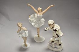 A Royal Doulton Figurine, December 3458, also included are two continental ballet dancer figurines.