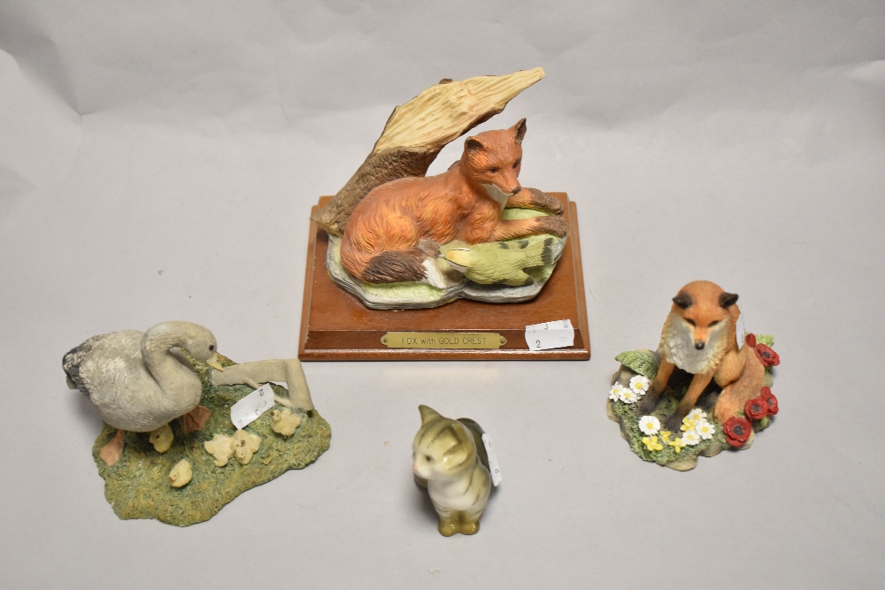 Four animal studies, including Beswick pottery cat and Aynsley Goose family.