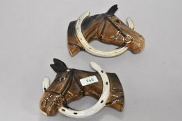 A pair of Beswick pottery horse head wall plaques, Looking through the horse shoe (806 and 807).