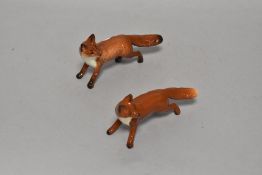 Two Beswick pottery fox studies.