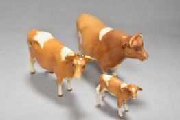 A Beswick Guernsey bull Sir Richmond 14th. 1451 with Cow 1248 and Calf 1249A having restoration to
