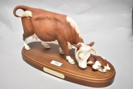 A Connoisseur Beswick Pottery Hereford cow and calf on plinth A2267, in matte finish.