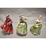 A group of three Royal Doulton porcelain figurines, comprising Lilac Time HN2137, Clarissa HN2345