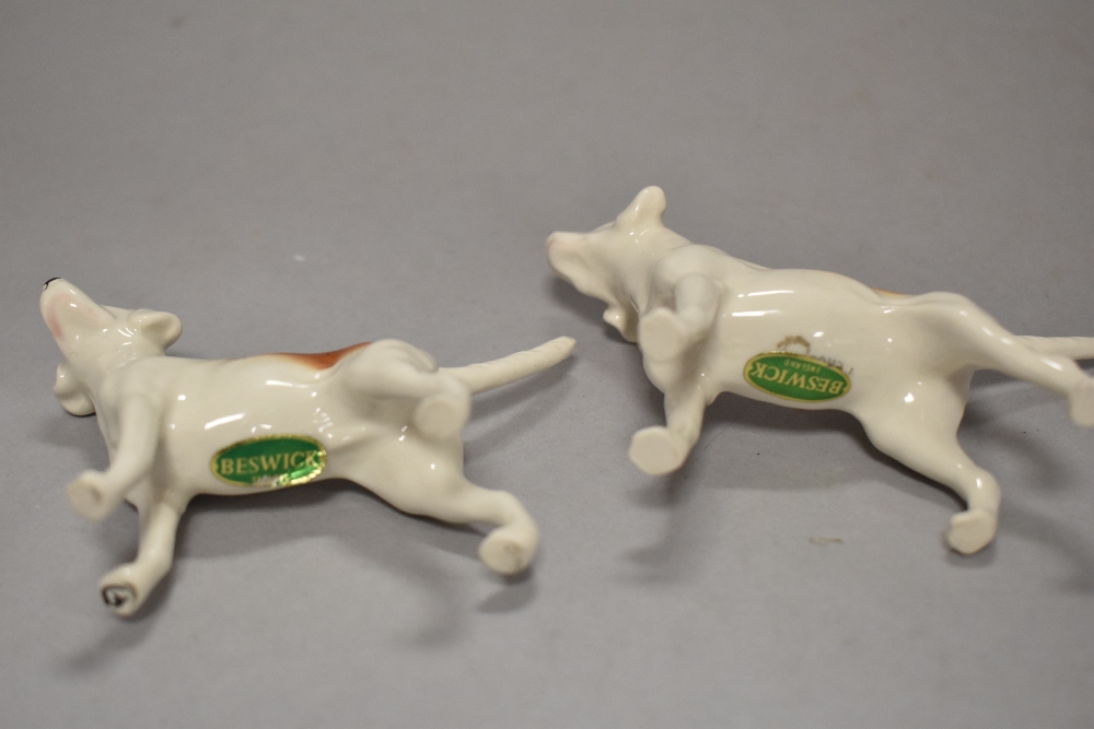 A Beswick pottery figure, The huntsman, four hounds in various poses and a fox. - Image 4 of 5