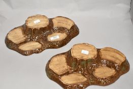 Two Beswick pottery tree trunk display stands.