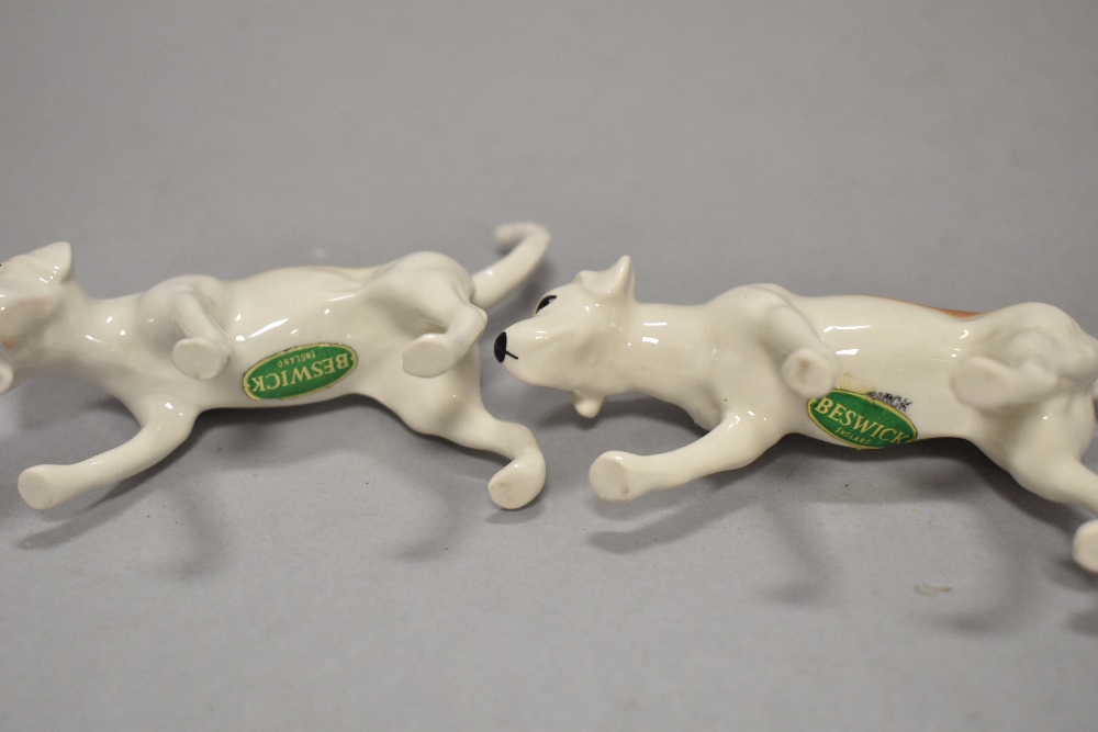 A Beswick pottery figure, The huntsman, four hounds in various poses and a fox. - Image 3 of 5