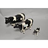 A Beswick Pottery Friesian cattle family, comprising; Coddington Hilt Bar bull, Claybury Leegwater