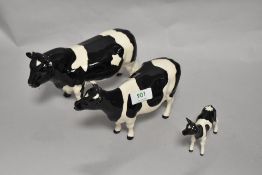 A Beswick Pottery Friesian cattle family, comprising; Coddington Hilt Bar bull, Claybury Leegwater