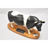 A Connoisseur Beswick Pottery Friesian Bull on plinth A2508 in matte finish.