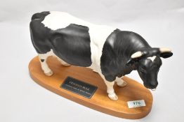 A Connoisseur Beswick Pottery Friesian Bull on plinth A2508 in matte finish.