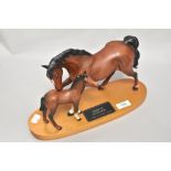 A Beswick pottery mare and foal study on wood plinth, Spirit of Affection,in matte finish.