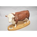 A Connoisseur Beswick Pottery palled Hereford Bull on plinth A2 574, in matte finish.