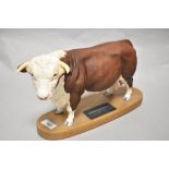 A Connoisseur Beswick Pottery Hereford Bull on plinth A2542A, in matte finish.