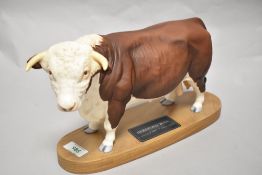 A Connoisseur Beswick Pottery Hereford Bull on plinth A2542A, in matte finish.