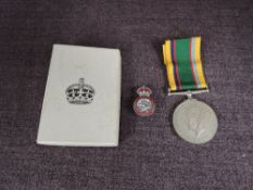 A George VI Cadet Forces Medal to A/Major.D.Rowan along with a Army Cadet Forces Badge
