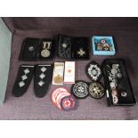 A collection of St John's Ambulance and Red Cross Medals, Badges and Epaulettes including Order of