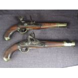 A pair of Austrian possibly Military Flintlock Pistols, one is af with hammer locked, trigger not