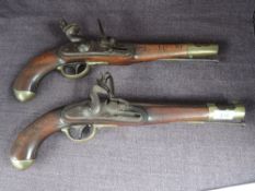 A pair of Austrian possibly Military Flintlock Pistols, one is af with hammer locked, trigger not