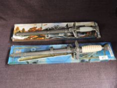 Two modern reproduction German WWII Daggers with scabbards in card boxes