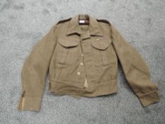 A 1940 WW2 Officers Battle Dress Blouse size number 7, made by G Glanfield & Son with cloth pips