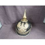 A German leather Pickelhaube Helmet having helmet brass winged eagle Koenig FR, brass spike to