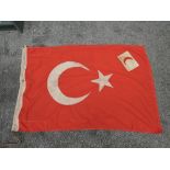 A WWI Turkish Flag marked on end of flag Turkish Symbol 1917 and Armband in white with red