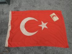 A WWI Turkish Flag marked on end of flag Turkish Symbol 1917 and Armband in white with red
