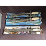 Three modern reproduction German WWII Daggers with scabbards in card boxes