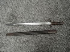 A British SMLE Bayonet pattern 1907 with metal and leather scabbard, blade marked with Crown ER 1907