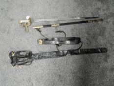A British Naval Officers Sword and scabbard with belt, brass guard with portepee knot, belonging